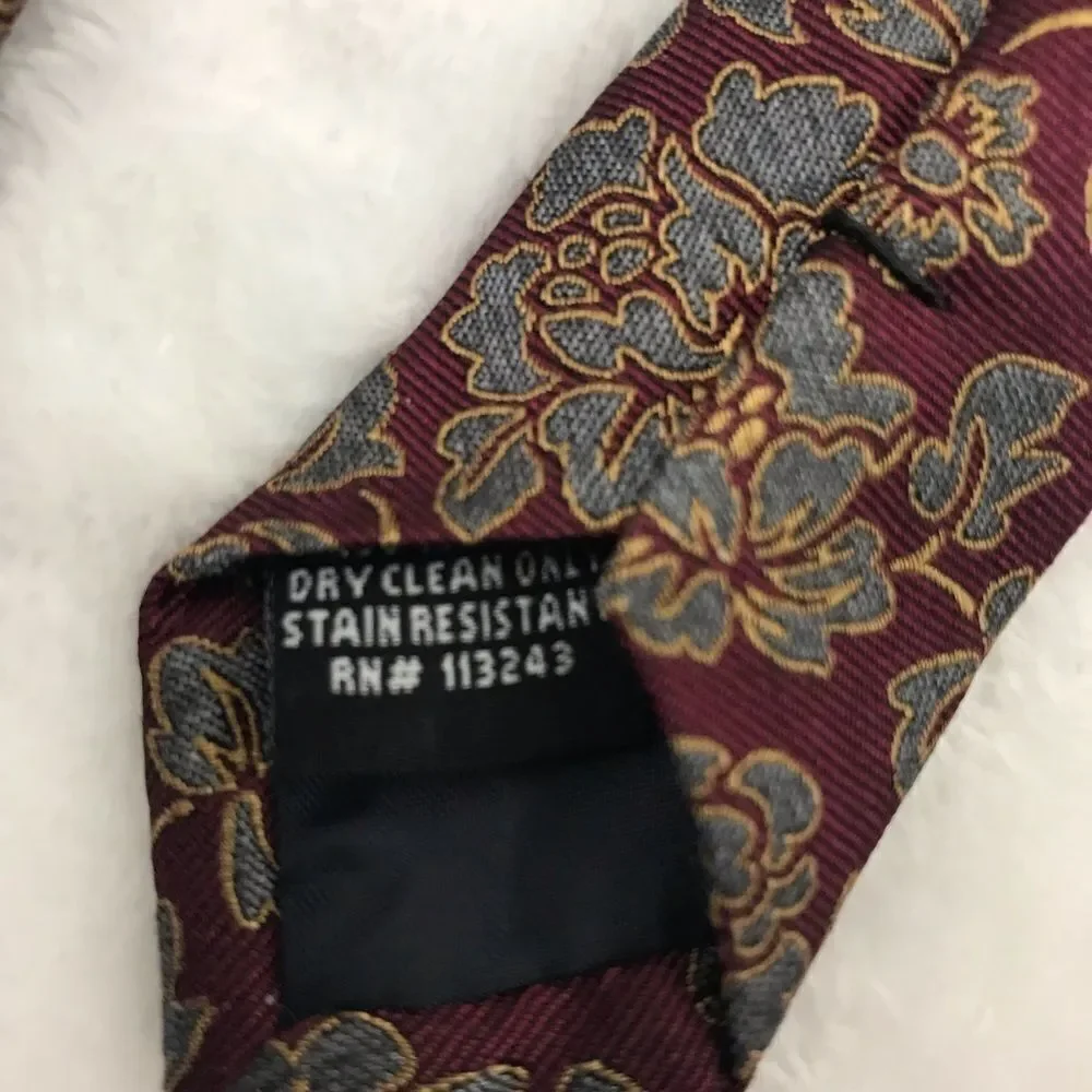 The Tie Bar deep red with‎ blue and gold floral design necktie.
